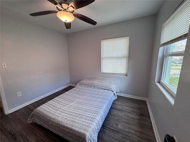 bedroom featuring dark wood-type flooring and ceiling fan