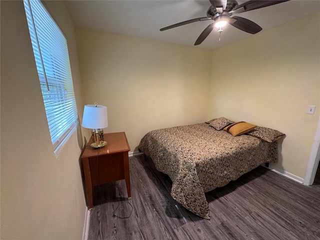 bedroom featuring dark wood-type flooring and ceiling fan