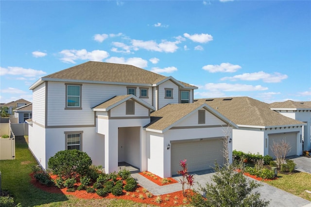 view of front facade with a garage and a front lawn