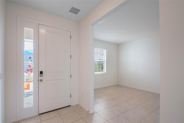 entryway featuring light tile patterned flooring