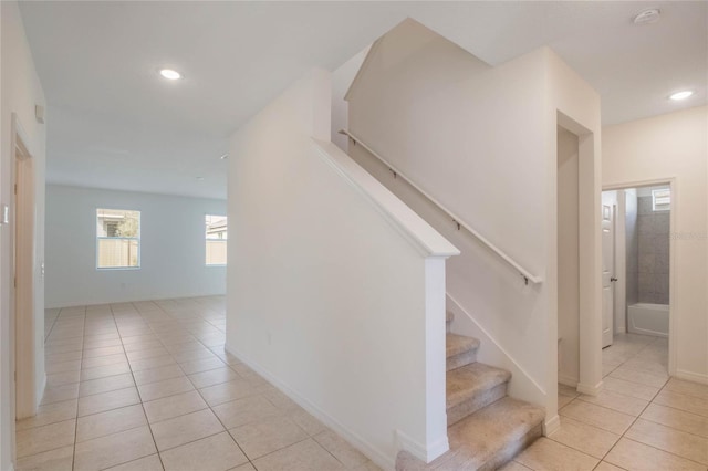 stairs with tile patterned floors