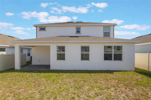 rear view of property with a patio area and a lawn