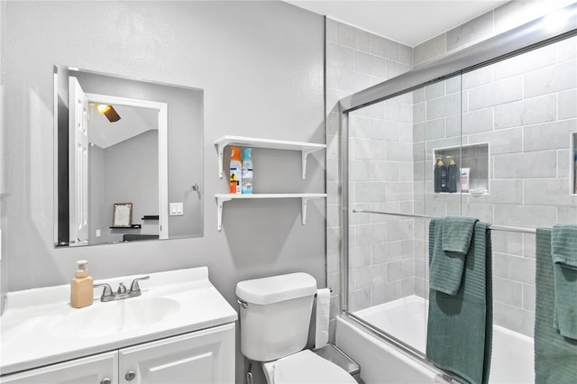 full bathroom with vanity, combined bath / shower with glass door, and toilet