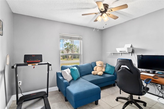 office area featuring ceiling fan, a textured ceiling, and light tile patterned floors