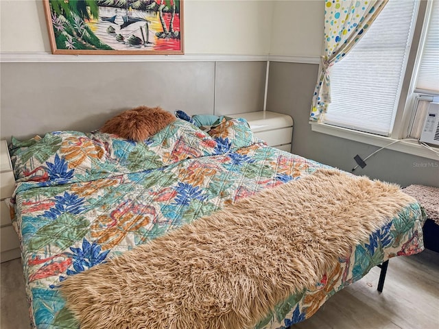 bedroom with hardwood / wood-style floors