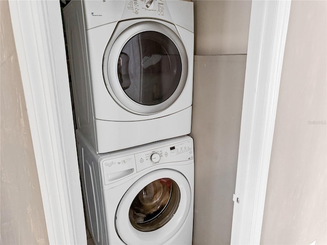 laundry room featuring stacked washer and dryer