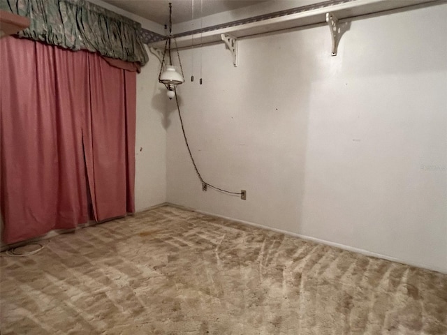 basement featuring light colored carpet