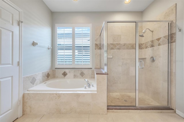 bathroom with tile patterned flooring and independent shower and bath