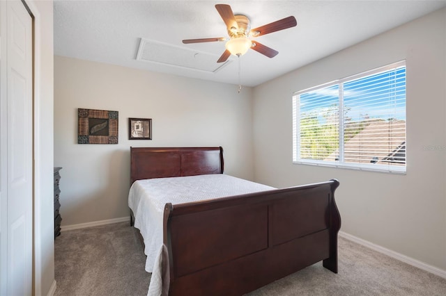 bedroom featuring light carpet and ceiling fan