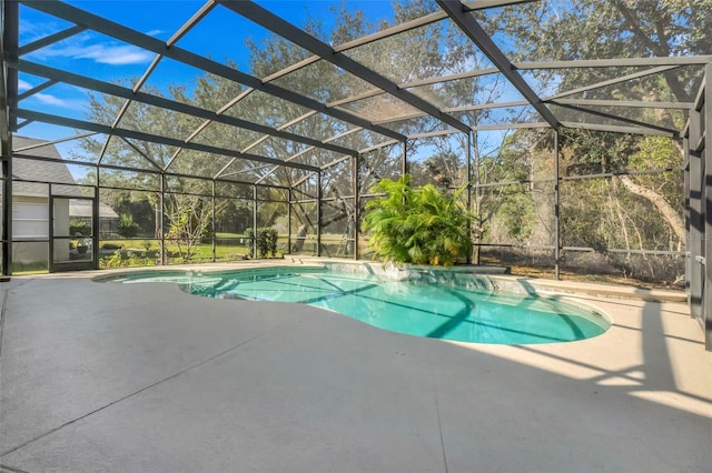 view of swimming pool with a patio and glass enclosure