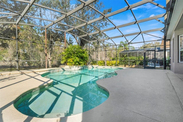 view of swimming pool with a lanai and a patio