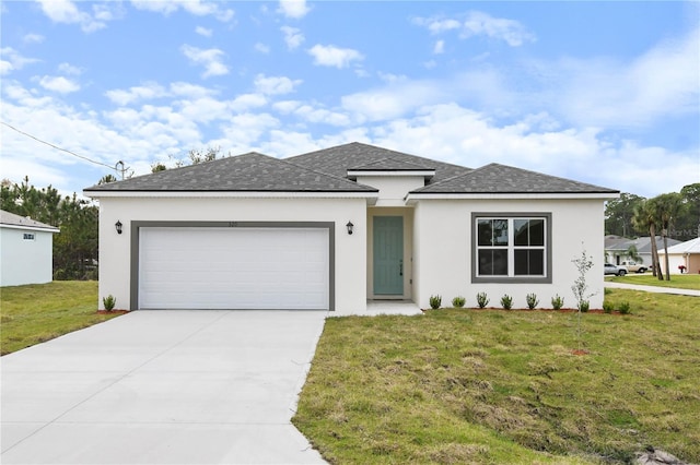 view of front of property featuring a garage and a front lawn