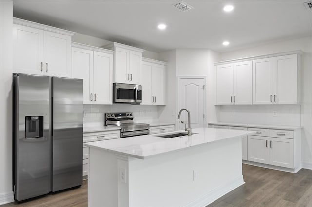 kitchen featuring white cabinetry, sink, and appliances with stainless steel finishes