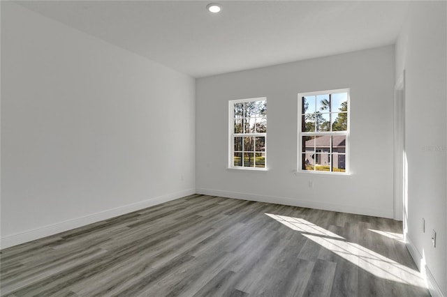 empty room with hardwood / wood-style floors