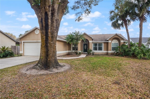 single story home with a garage and a front yard