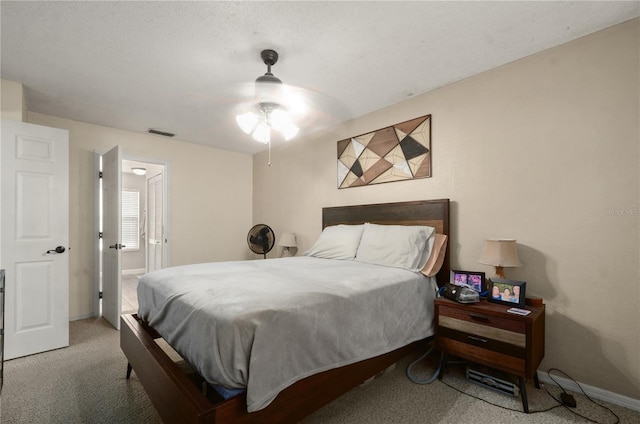 bedroom with ceiling fan and carpet floors