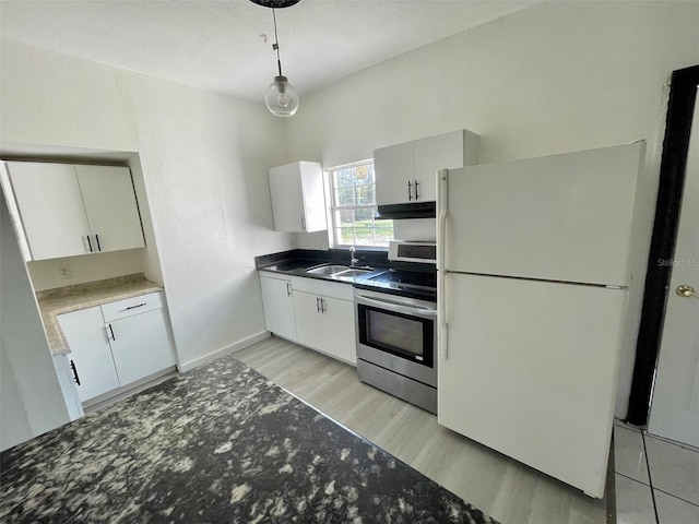 kitchen featuring sink, white cabinetry, hanging light fixtures, light wood-type flooring, and white appliances