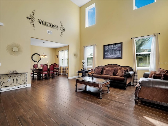 living room featuring hardwood / wood-style floors and a notable chandelier