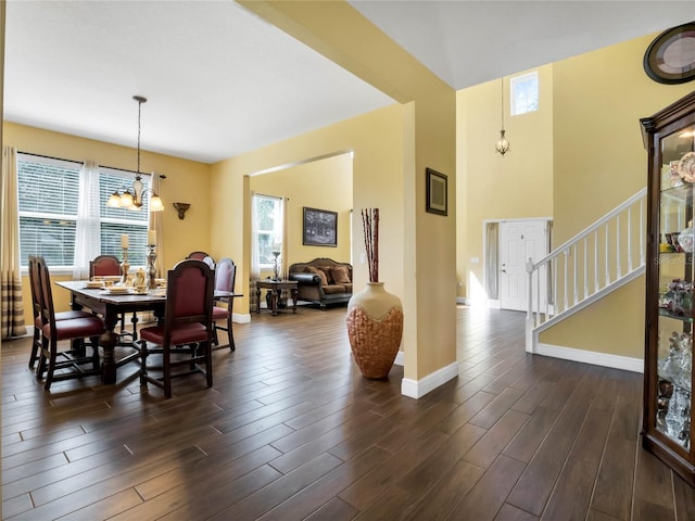 dining room featuring dark hardwood / wood-style flooring, a chandelier, and a wealth of natural light