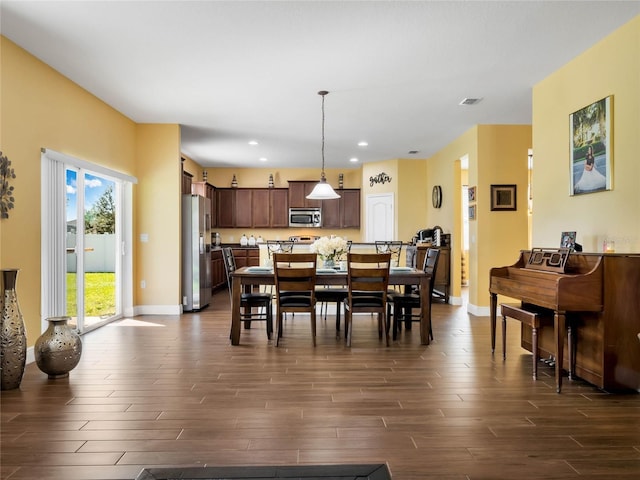 dining area featuring dark hardwood / wood-style flooring