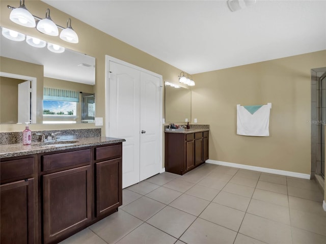 bathroom featuring tile patterned floors, vanity, and an enclosed shower