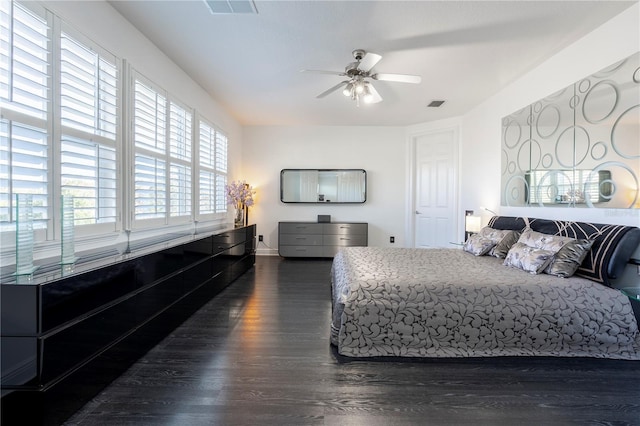 bedroom featuring dark wood-type flooring and ceiling fan