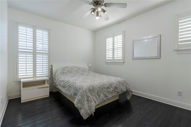 bedroom featuring ceiling fan and dark hardwood / wood-style flooring