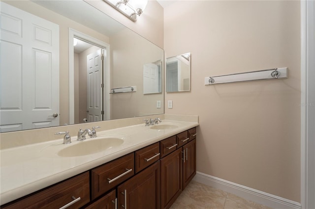 bathroom featuring tile patterned flooring and vanity