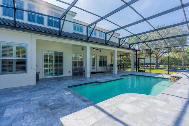 view of pool featuring ceiling fan, a lanai, and a patio