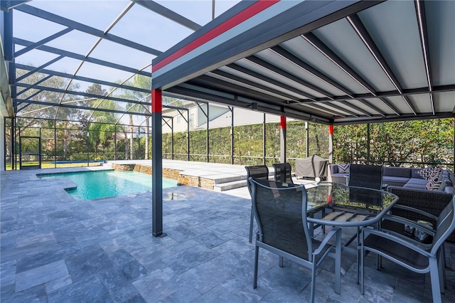 view of pool featuring pool water feature, an outdoor living space, glass enclosure, and a patio area