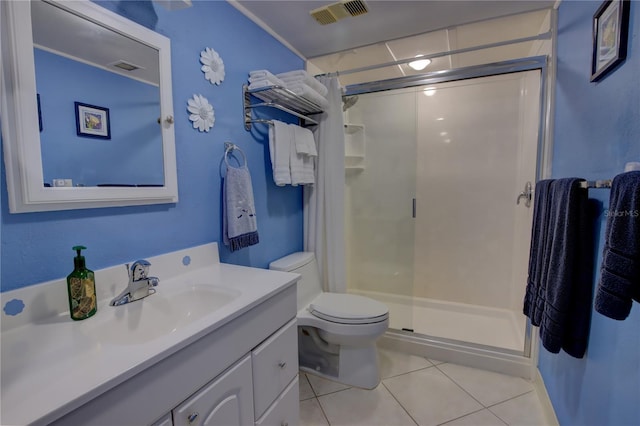 bathroom with vanity, a shower with door, tile patterned floors, and toilet