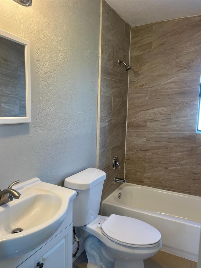 1315 Carlsbad Pl, Orlando, FL 32808 - full bathroom featuring tiled shower / bath combo, vanity, and toilet