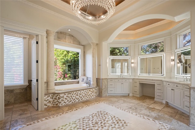 bathroom featuring crown molding, vanity, and tiled tub