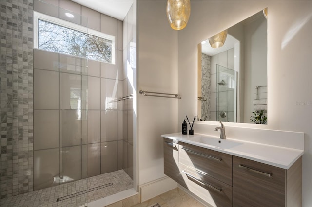 bathroom featuring vanity and a tile shower