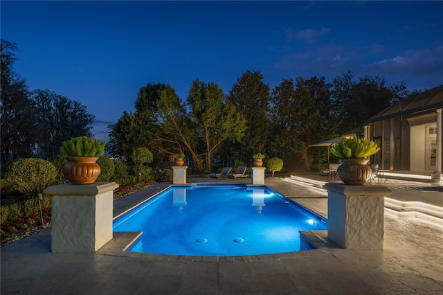 view of swimming pool featuring a patio area