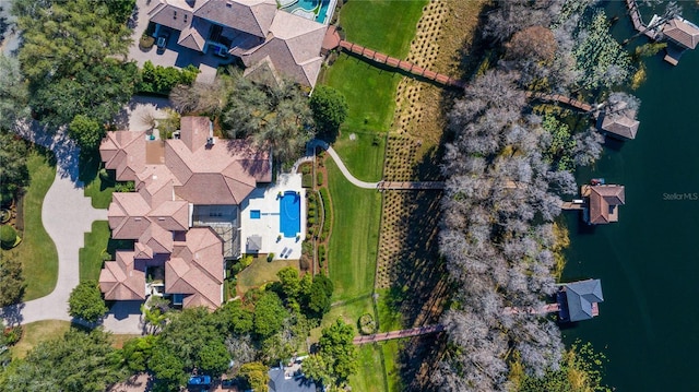 birds eye view of property with a water view