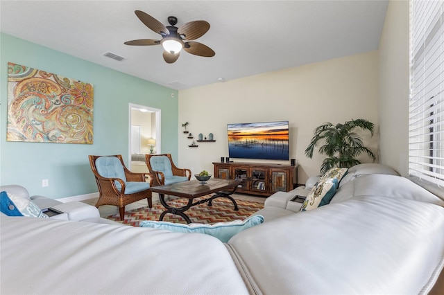 1494 Moon Valley Dr, Davenport, FL 33896 - living area featuring ceiling fan and baseboards