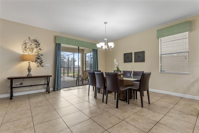 1494 Moon Valley Dr, Davenport, FL 33896 - dining area featuring a chandelier and light tile patterned floors