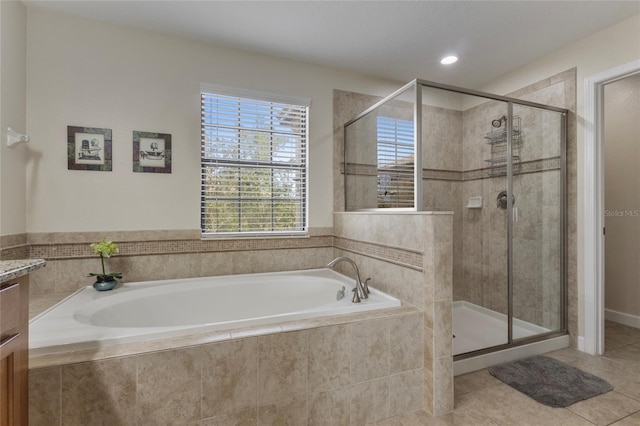 1494 Moon Valley Dr, Davenport, FL 33896 - full bath with a garden tub, a shower stall, vanity, and tile patterned floors