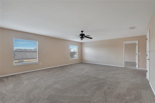 1515 Angler Ave, Kissimmee, FL 34746 - spare room featuring light carpet and ceiling fan