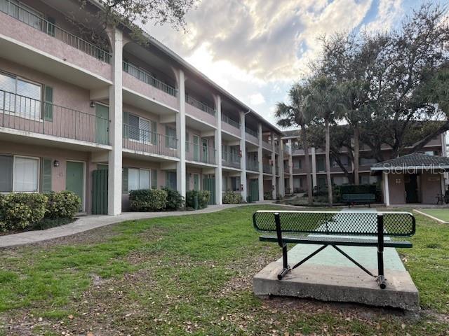 view of community featuring a lawn