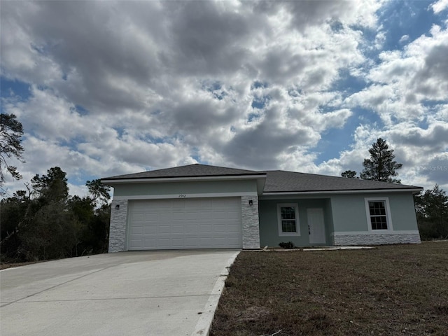 ranch-style house featuring a garage