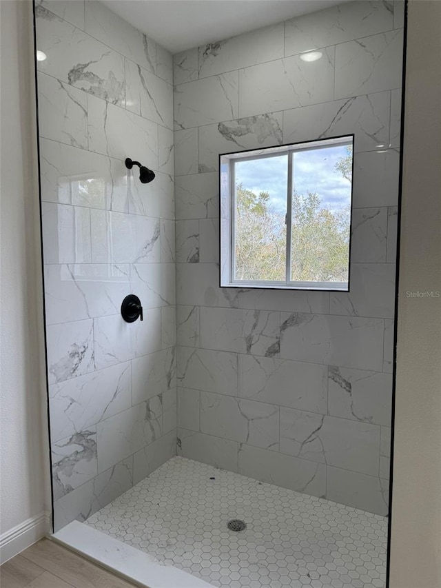 bathroom with a tile shower