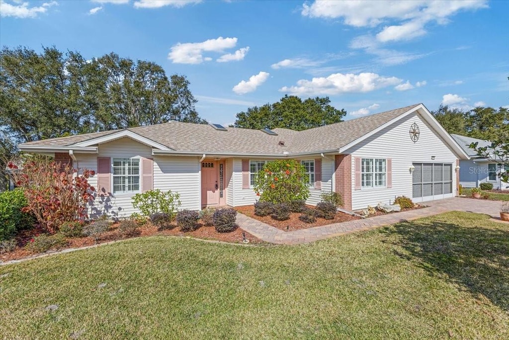 ranch-style house with a front lawn