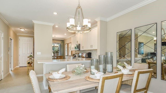 tiled dining space featuring an inviting chandelier and ornamental molding