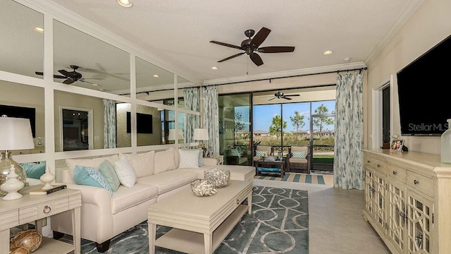 living room featuring ornamental molding, light tile patterned floors, and ceiling fan