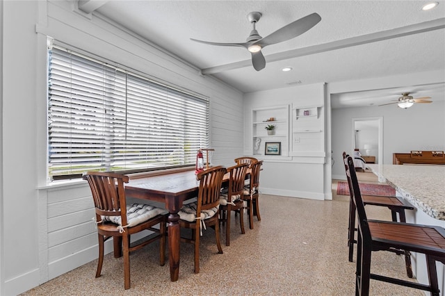 dining area with ceiling fan, plenty of natural light, and a textured ceiling