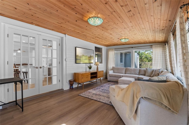 living room with wood-type flooring, wooden ceiling, and french doors