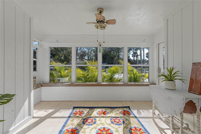 sunroom / solarium with ceiling fan