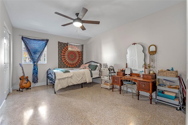 bedroom with ceiling fan and a closet